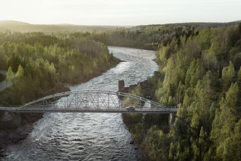 Epic view car driving over bridge north Sweden 
