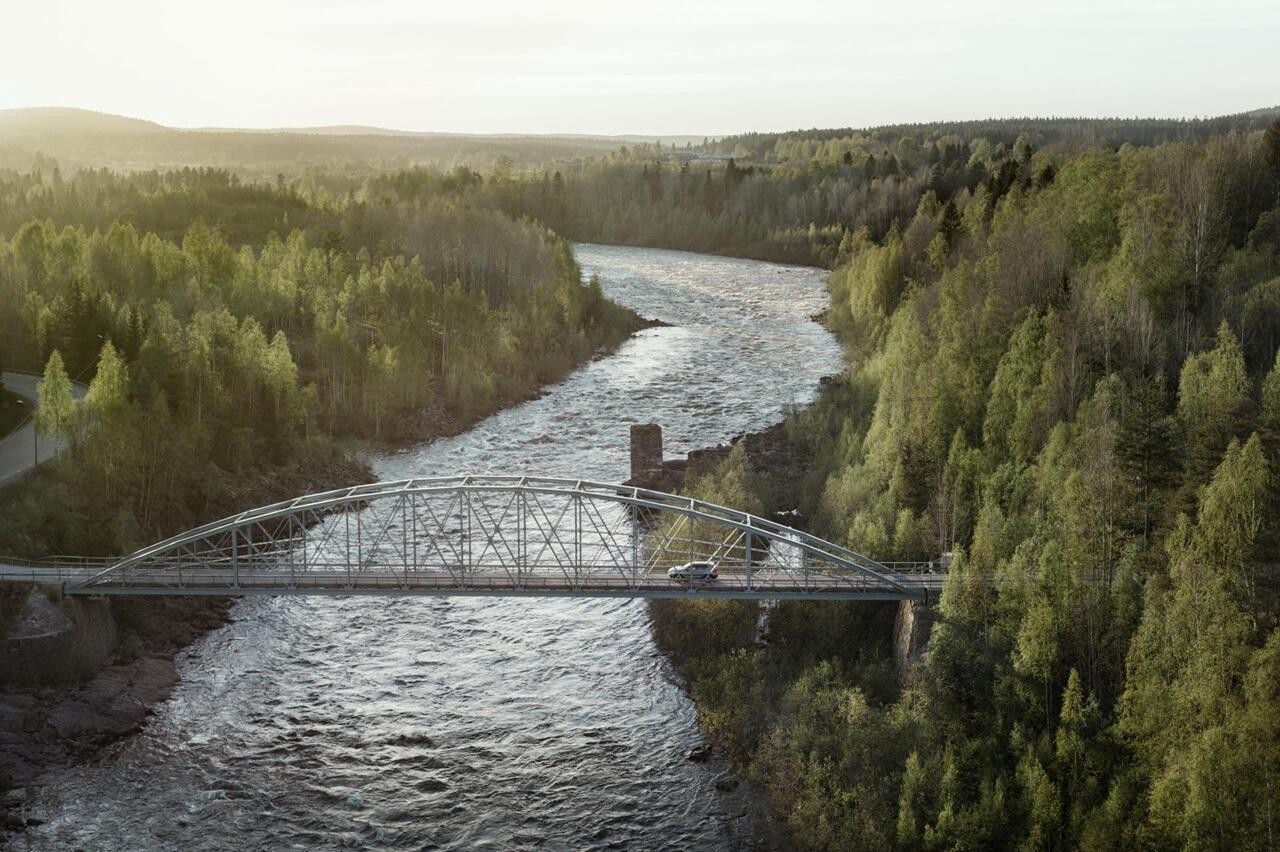 Epic view car driving over bridge north Sweden 